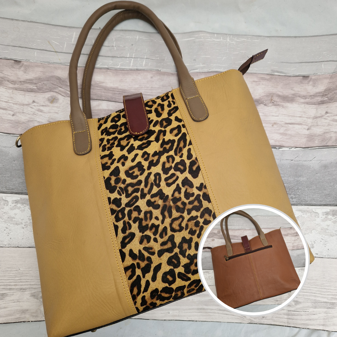 All leather tote bag in gold with a textured panel of leopard print running down the centre.