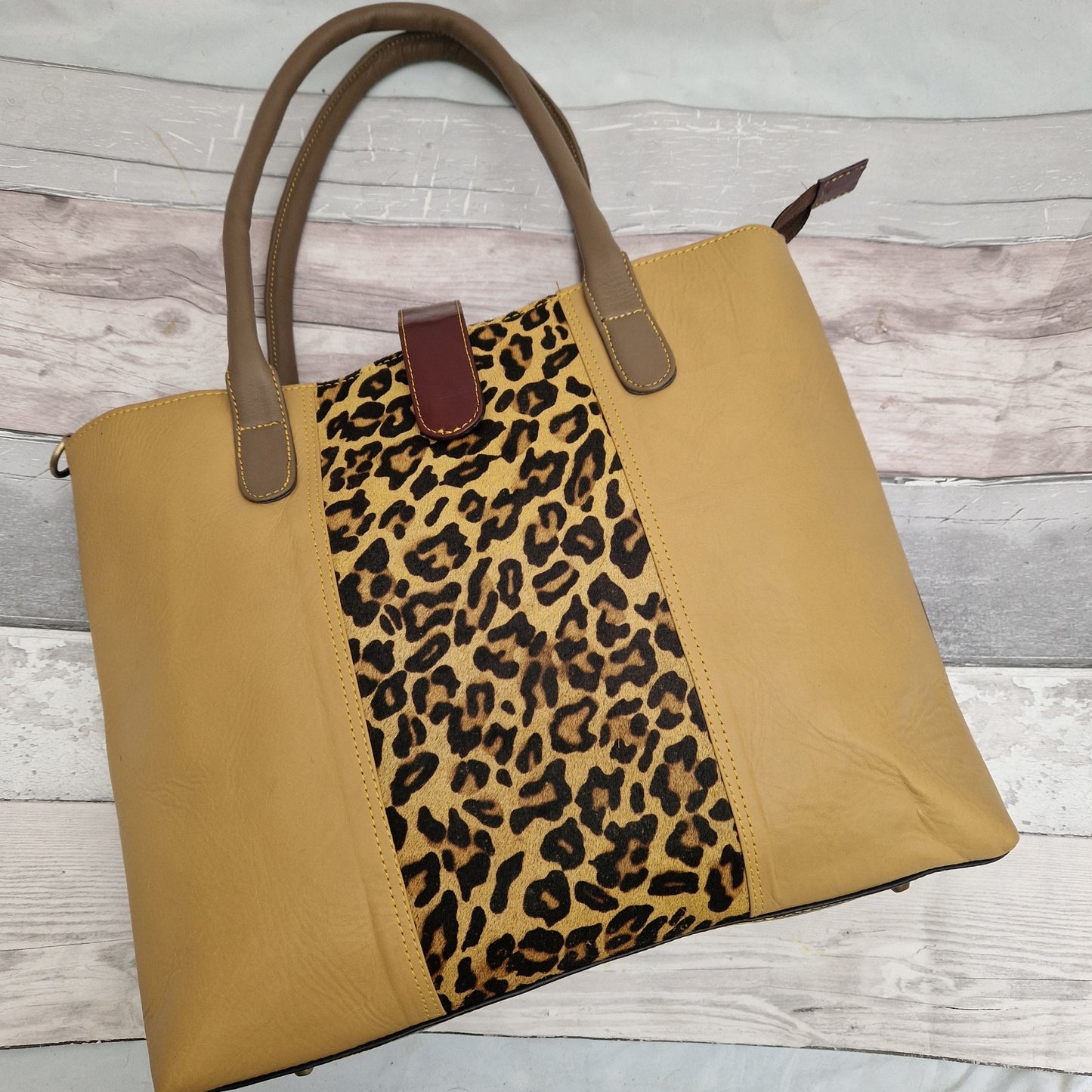 All leather gold coloured tote bag with leopard print panel.