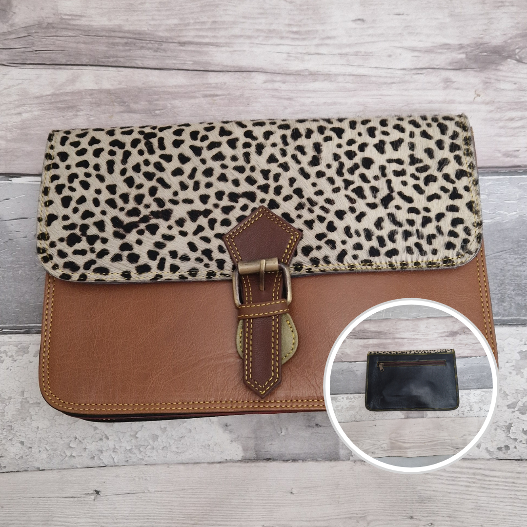 All leather envelope style crossbody bag in a textured animal print. Photo shows front and back of bag. Tan brown Leather with a textured panel of Iberian Lynx print.