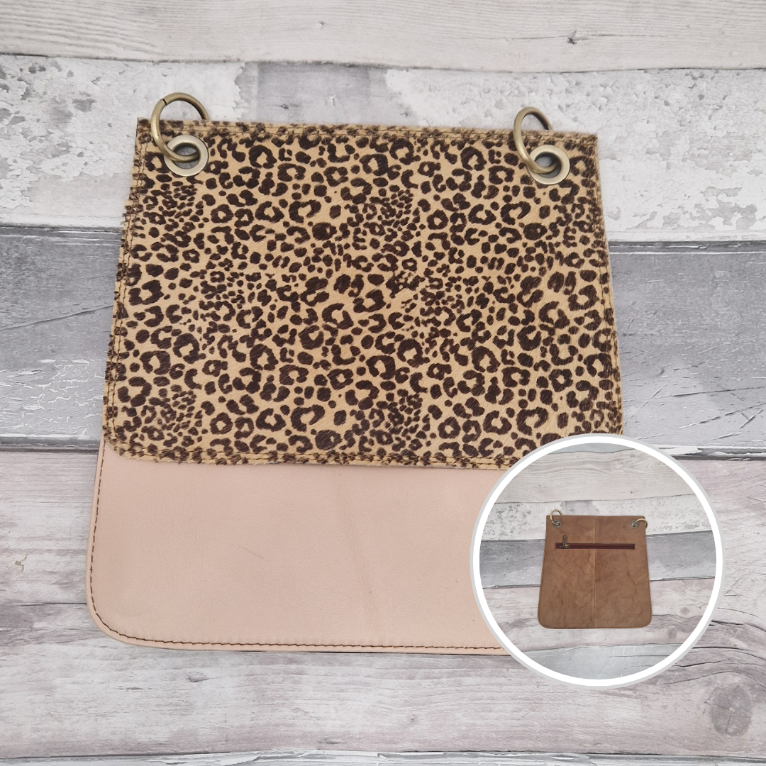 All leather modern messenger style bag with a blush panel and textured cheetah print panel.