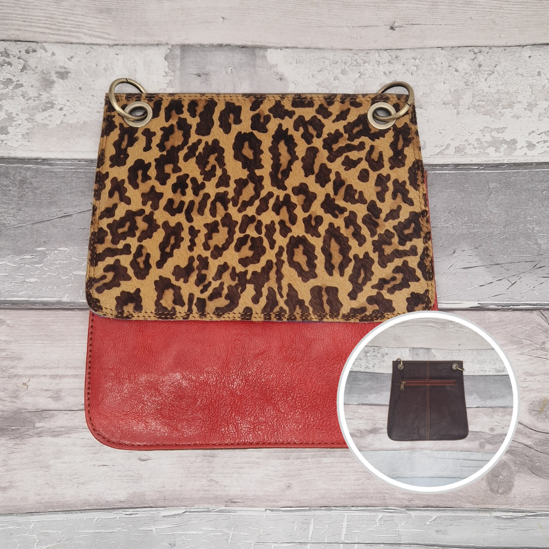 All leather modern messenger style bag with a red panel and textured Jaguar print panel.