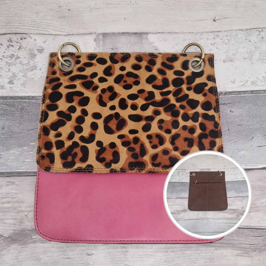 All leather modern messenger style bag with a bright pink panel and textured leopard print panel.