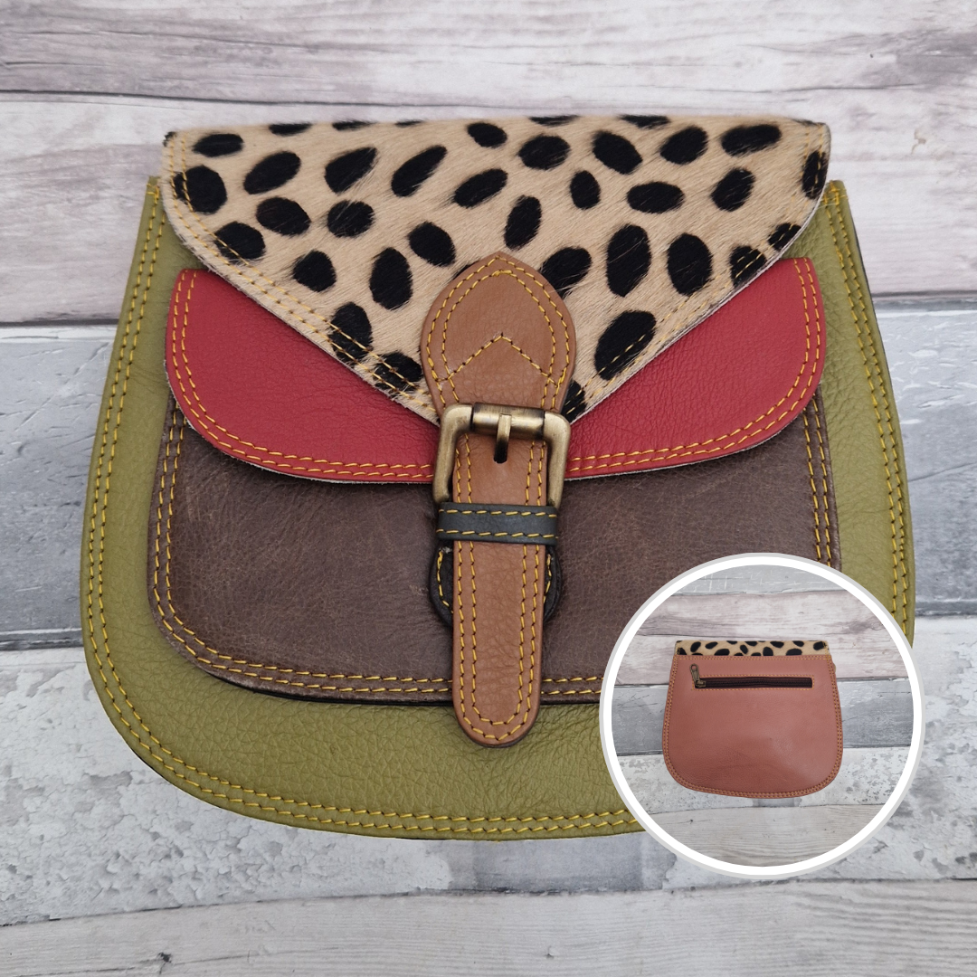 Saddlebag style bag in olive green leather with contrasting coloured panels and a section of textured spot print