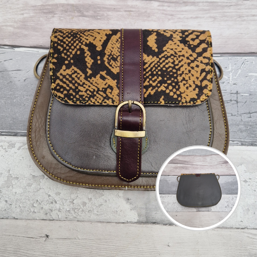 All leather mini saddlebag shaped bag in a mix of coloured panels. With a buckle detail and textured snake print panel.