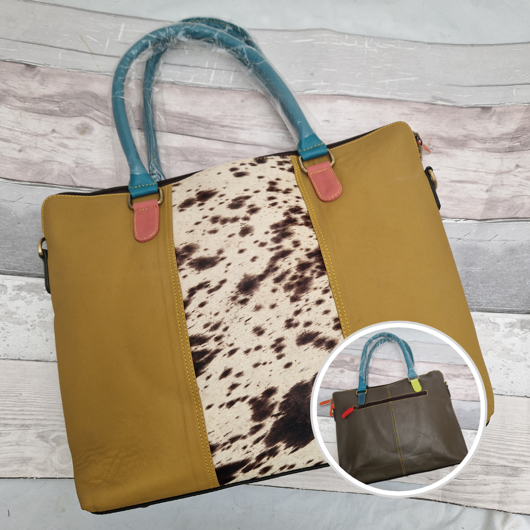 All leather mustard coloured tote bag with a cow hide print panel.