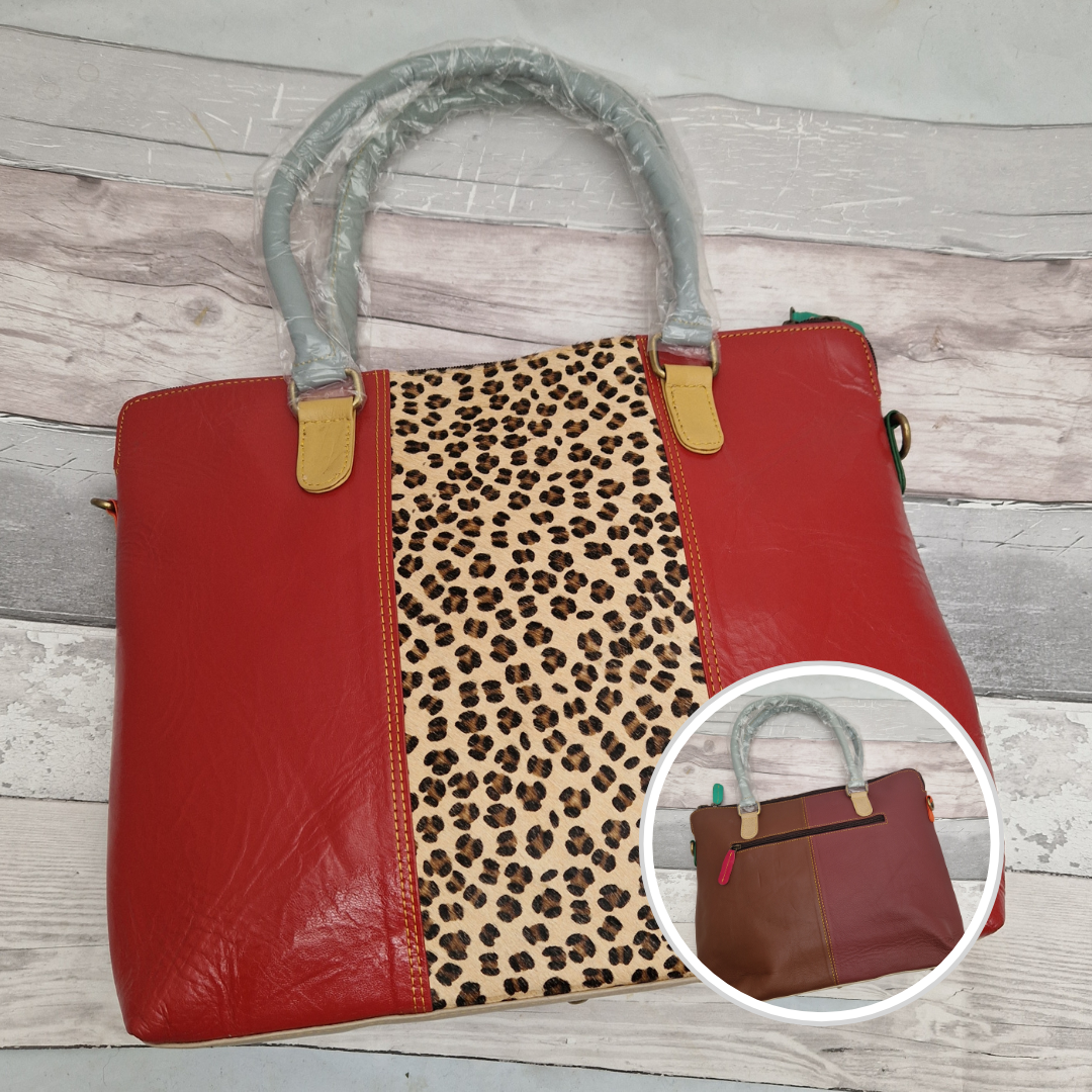 All leather red coloured tote bag with a leopard print panel.