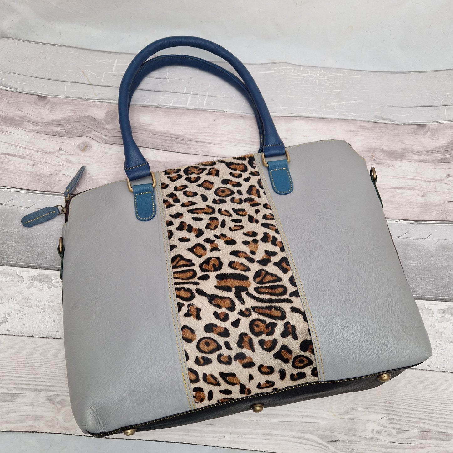 All leather grey coloured tote bag with a leopard print panel.