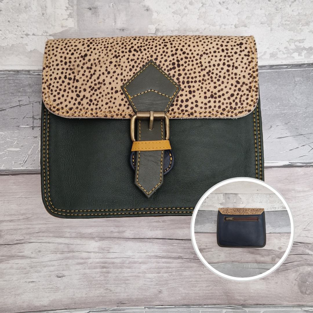 Square pill box shaped all leather bag with a dark green front and textured panel of spotty animal print.