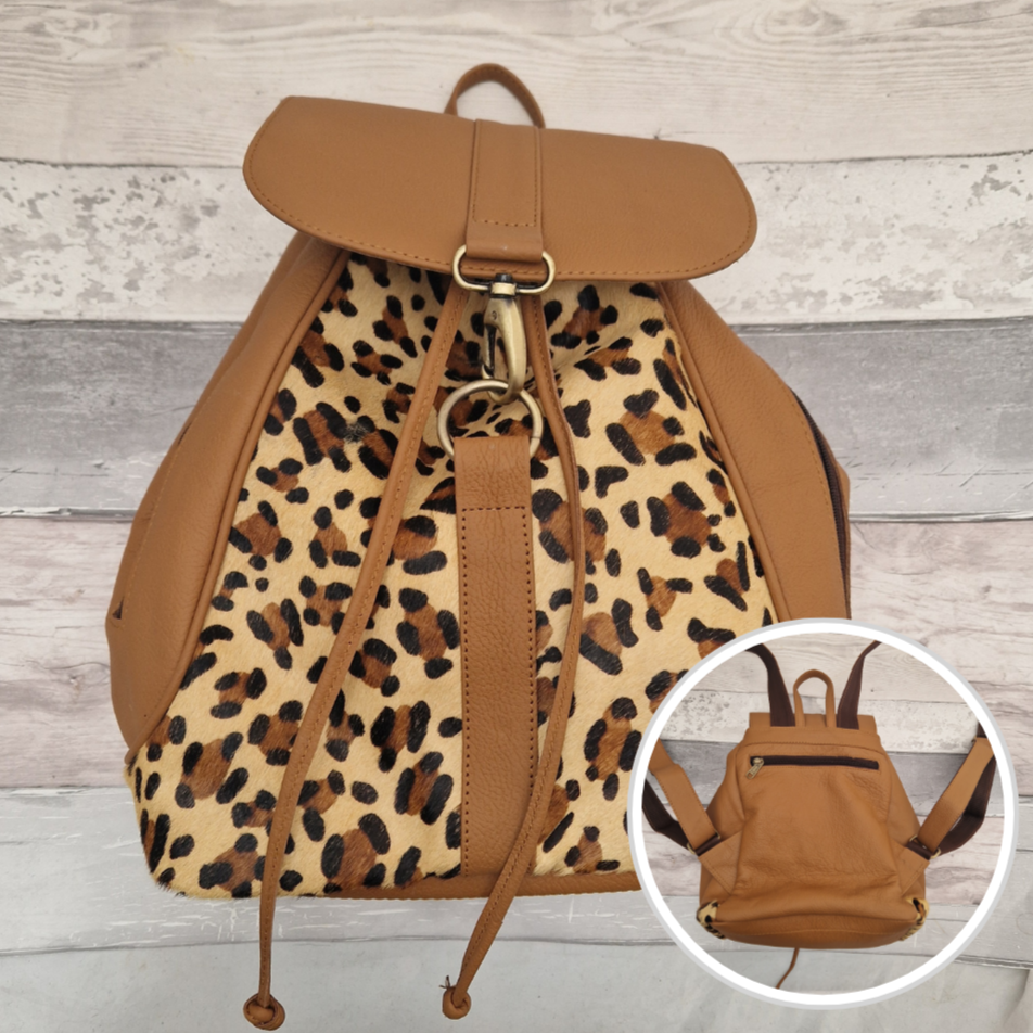 Tan leather back pack with textured panels of leopard print.