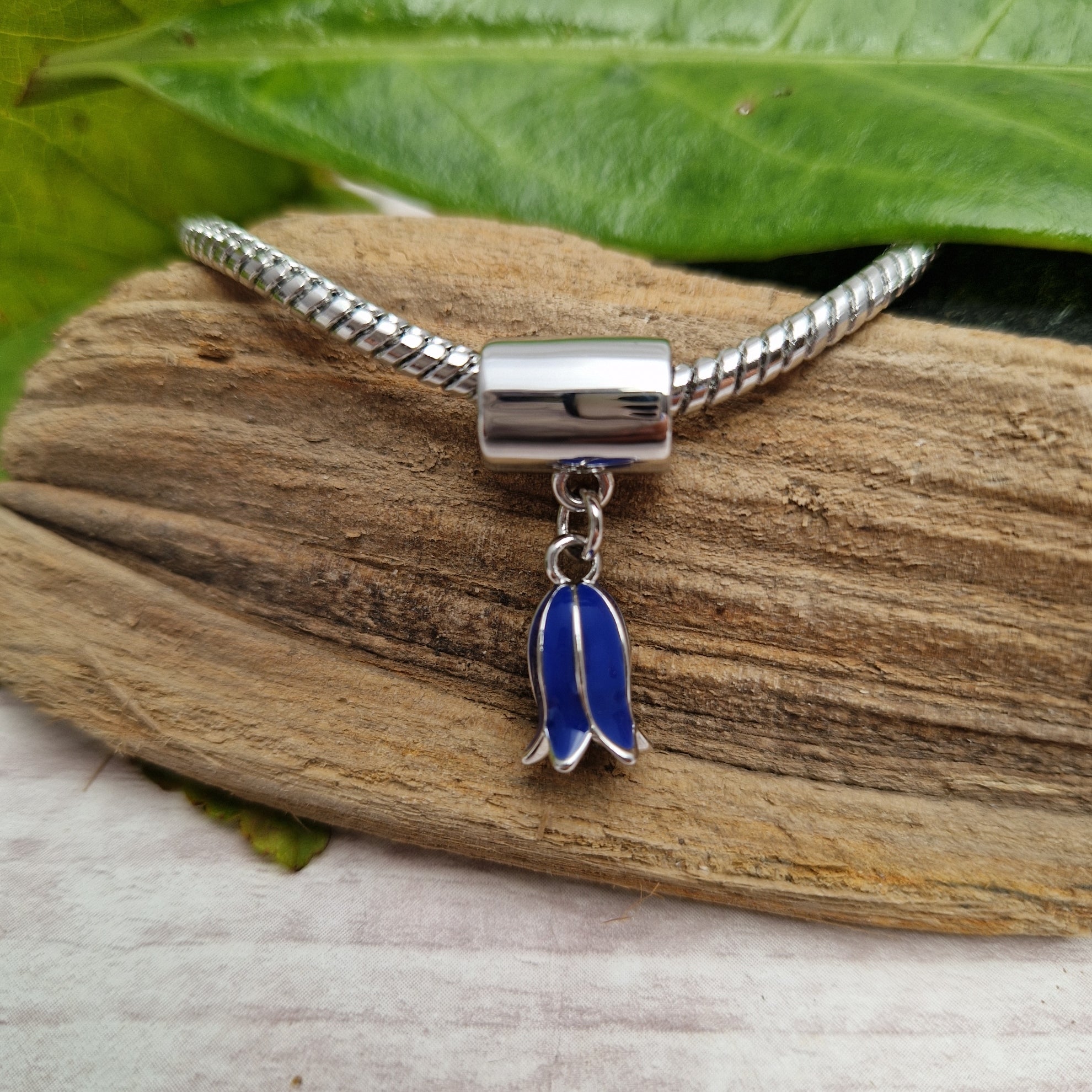 Swinging Bluebell Charm for a bracelet in a blue and silver finish.