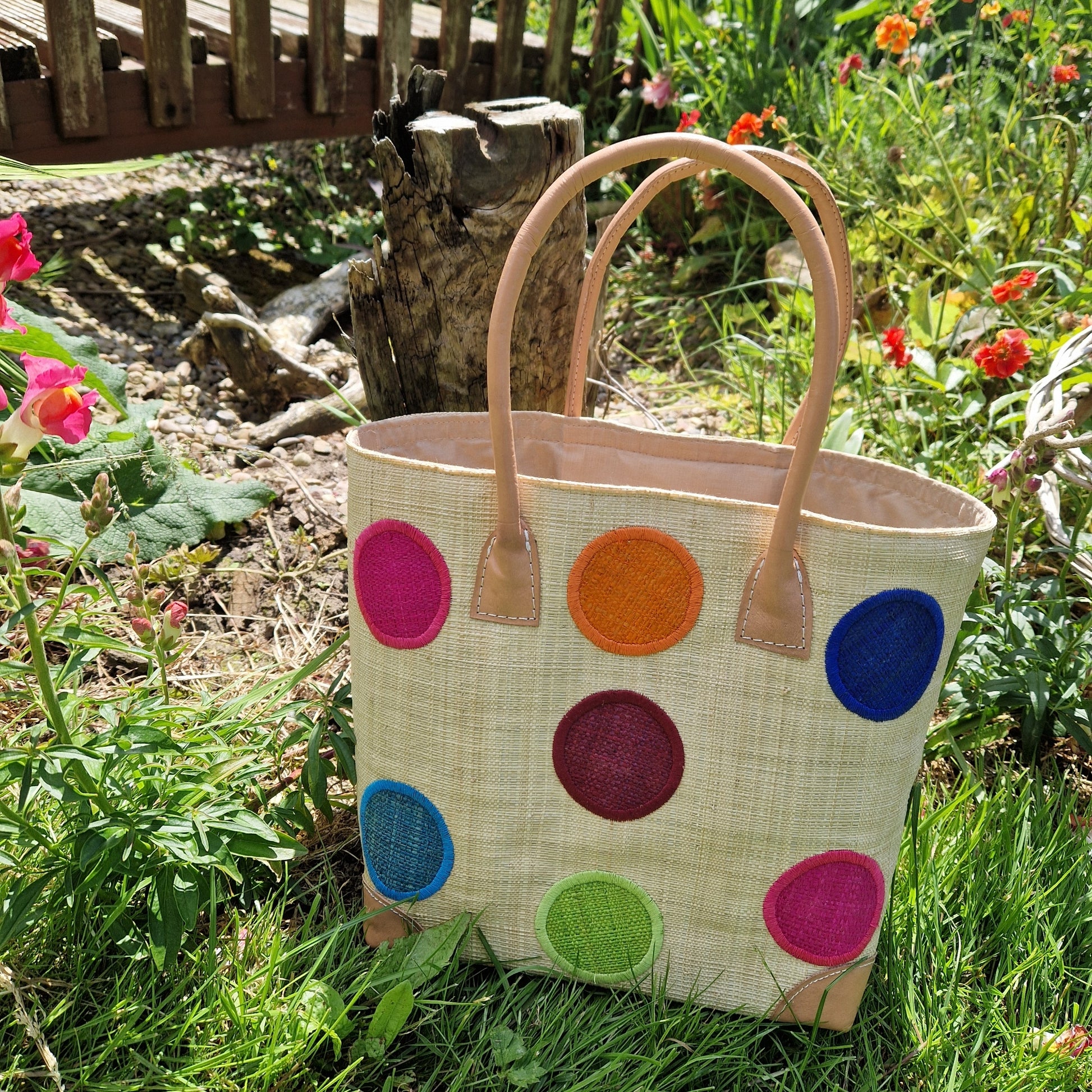 Natural Raffia Baskets with coloured spot pattern.