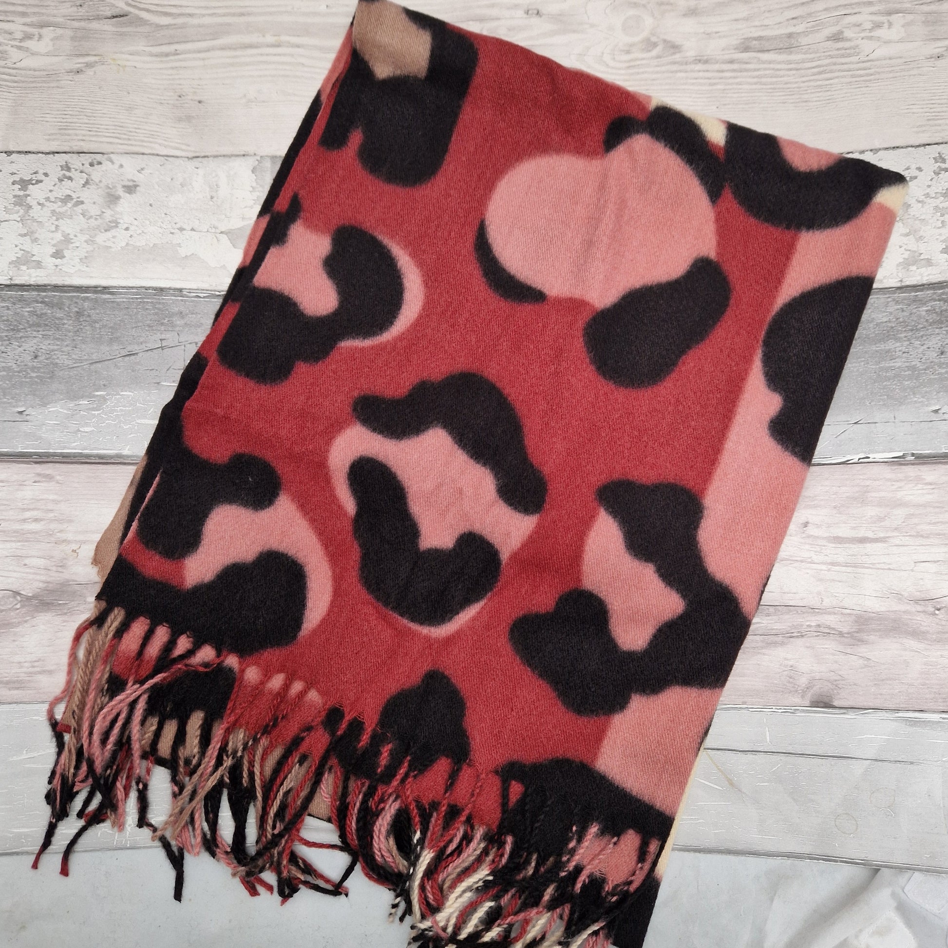 Abstract leopard print scarf in pink, cream, raspberry and mocha colours.