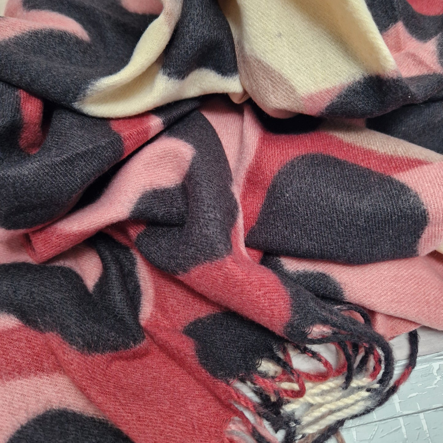 Abstract leopard print scarf in pink, cream, raspberry and mocha colours.