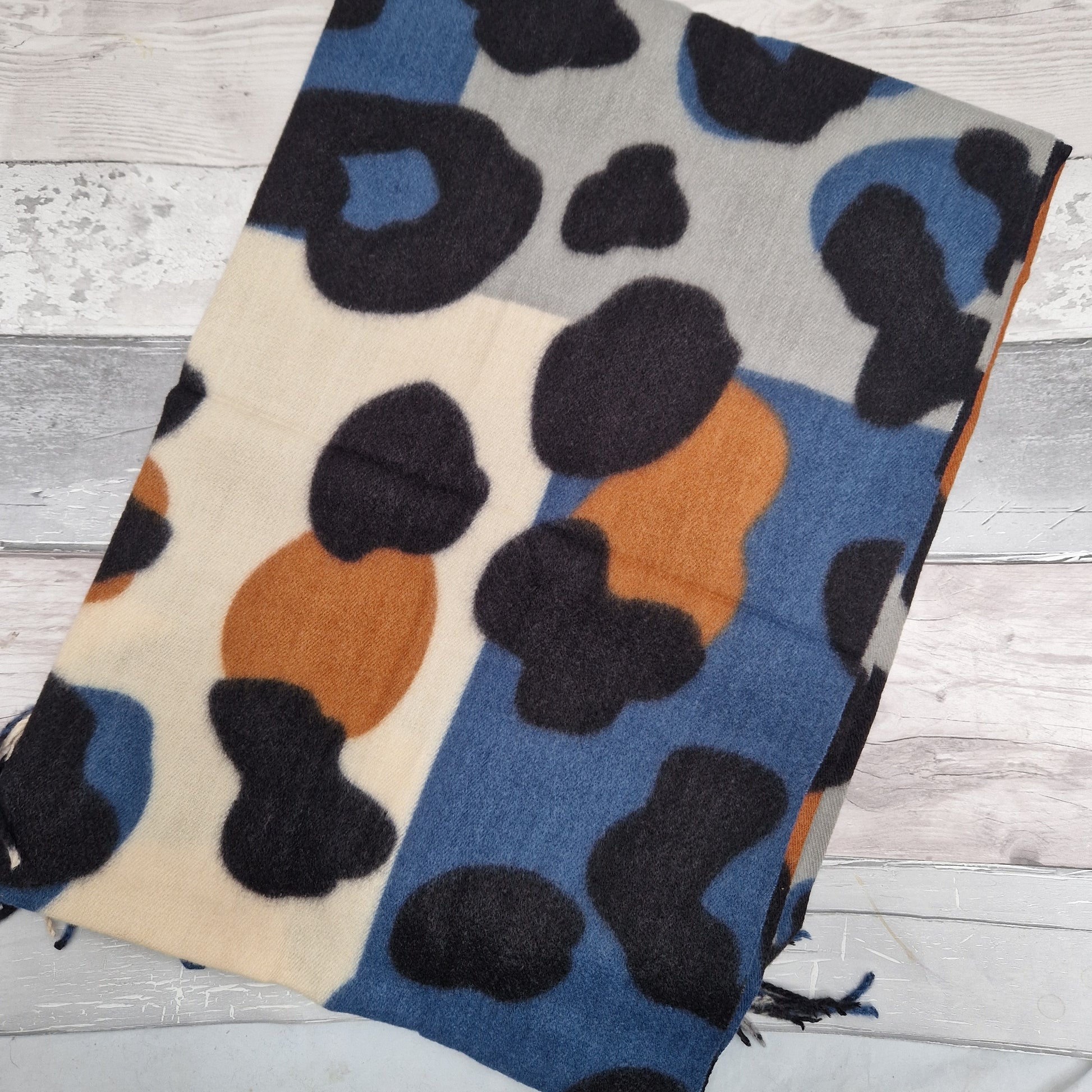 Abstract leopard print scarf in blue, grey, black, cream and tan colourings.