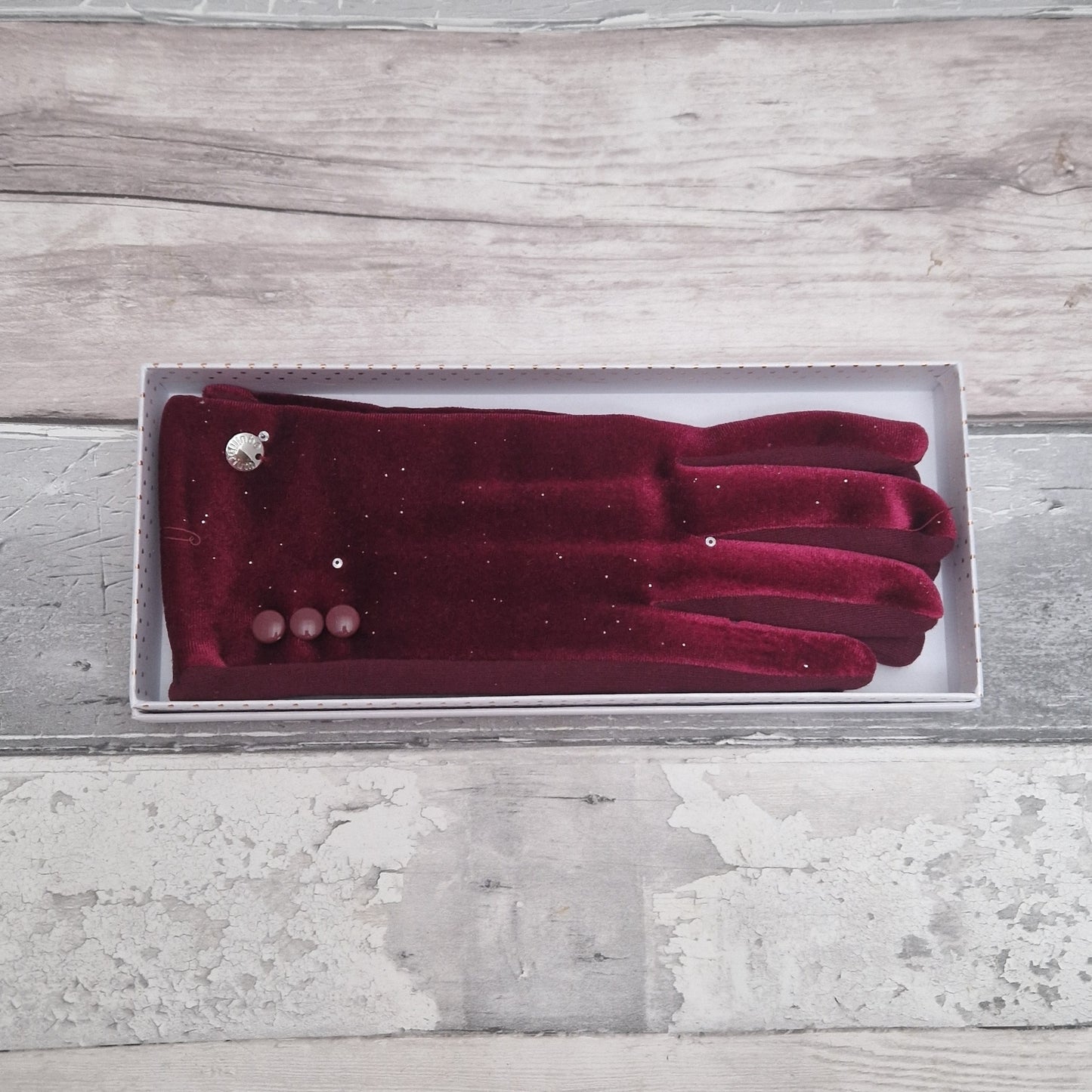 Deep Red velvet ladies gloves covered in a subtle silver sparkle. 3 Button Cuff detail. Gift Boxed.