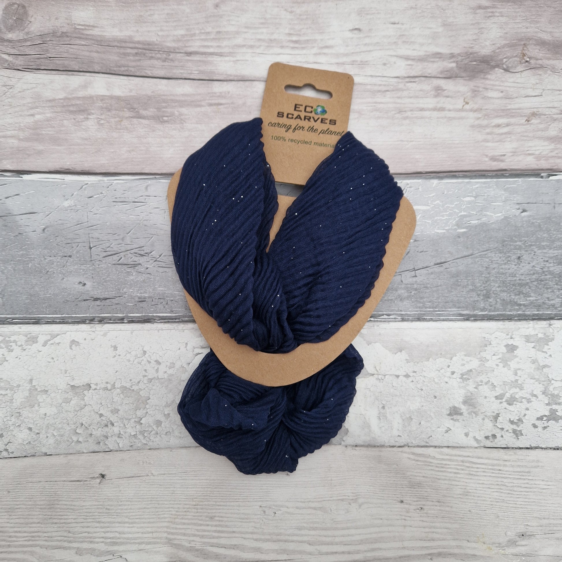 Navy coloured neck scarf with a crinkle texture and a fine silver sparkle and silver magnetic closers.