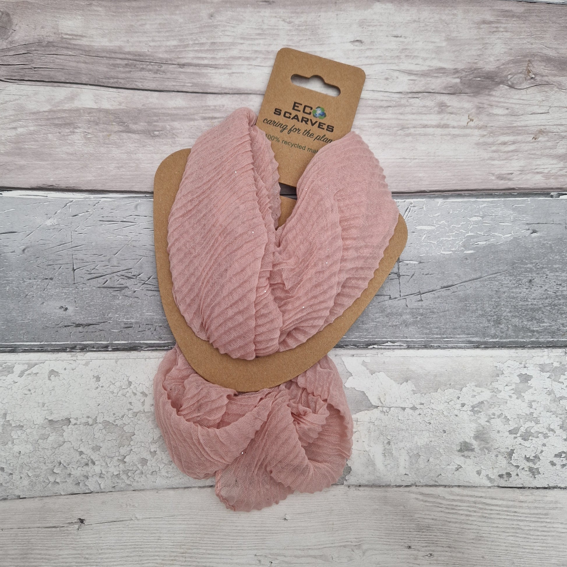 Pink coloured neck scarf with a crinkle texture and a fine silver sparkle and silver magnetic closers.