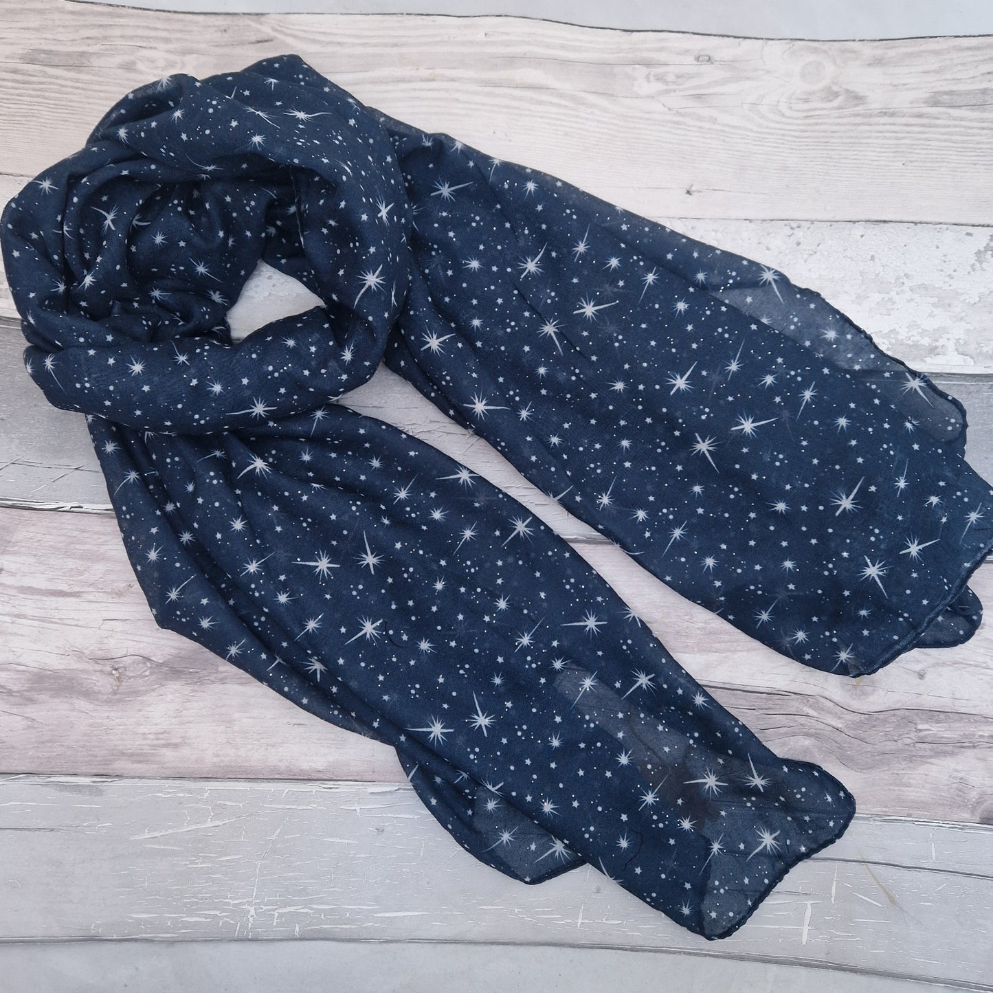 Navy Scarf covered in a star print.