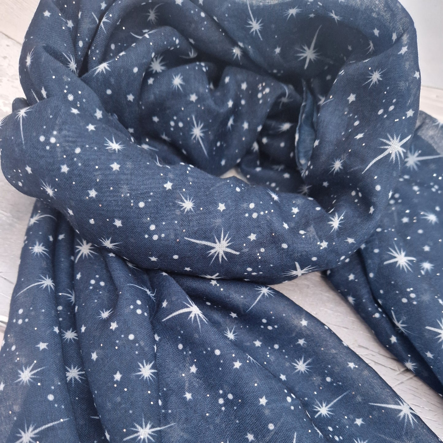 Navy Scarf covered in a star print.