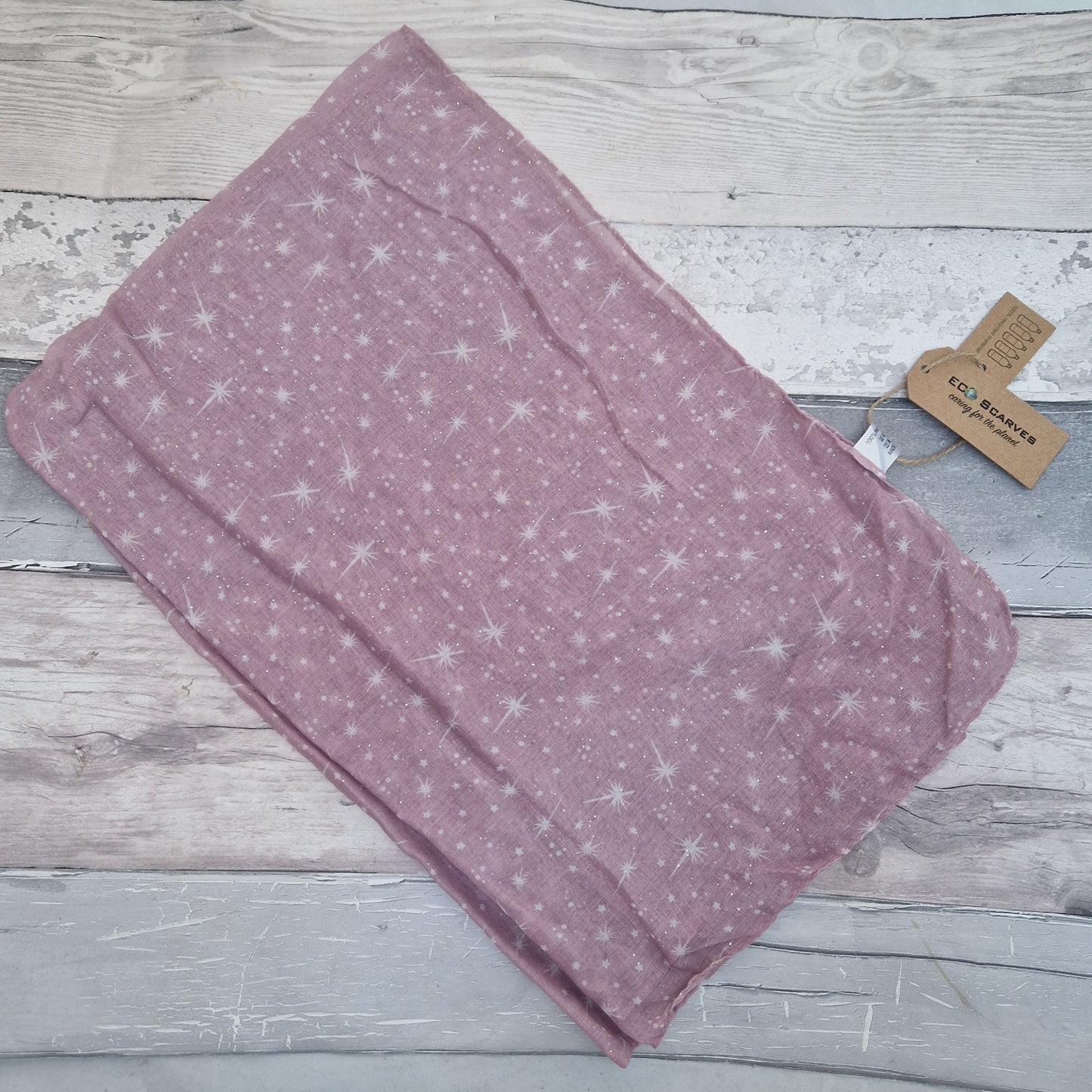 Pink Scarf covered in a star print.