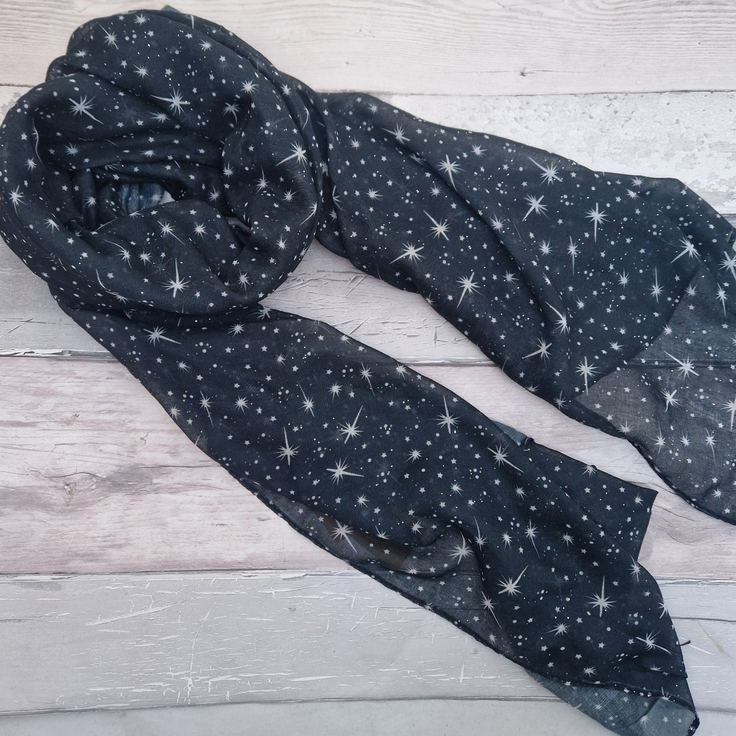 Black Scarf covered in a star print.