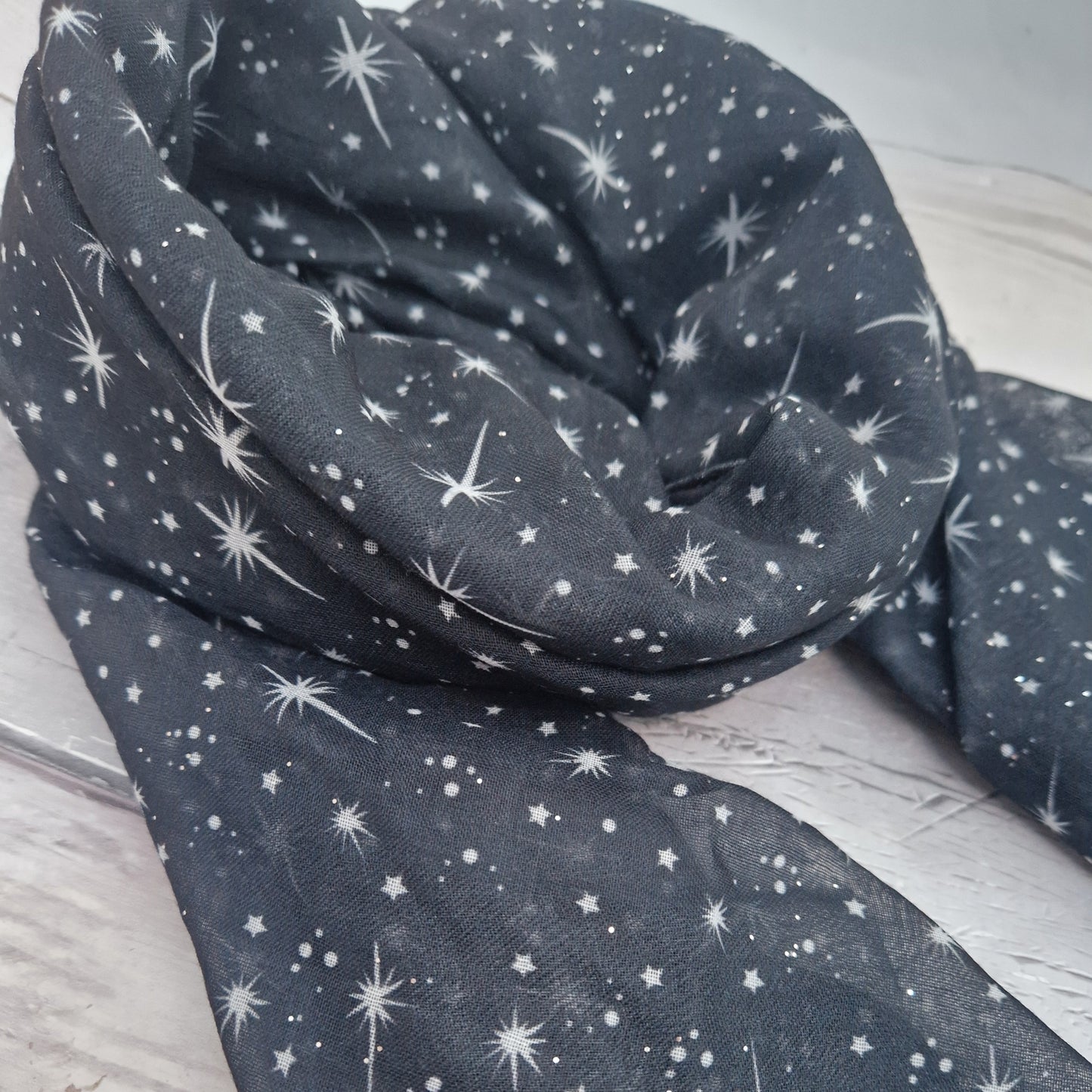 Black Scarf covered in a star print.