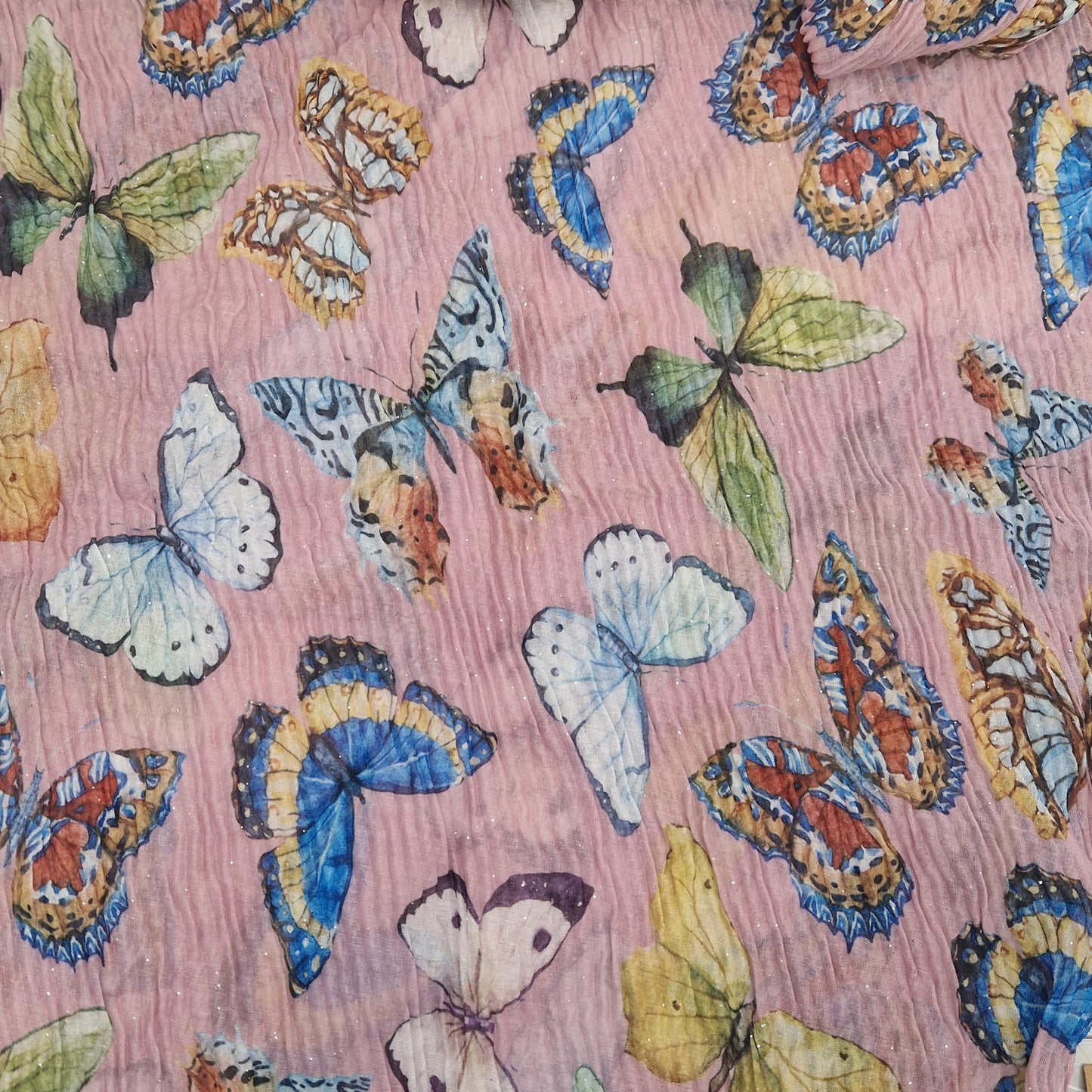 Crinkled textured scarf in Pink with very pretty collection of butterfly images in different colours.