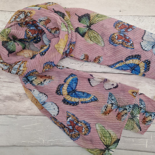 Crinkled textured scarf in Pink with very pretty collection of butterfly images in different colours.