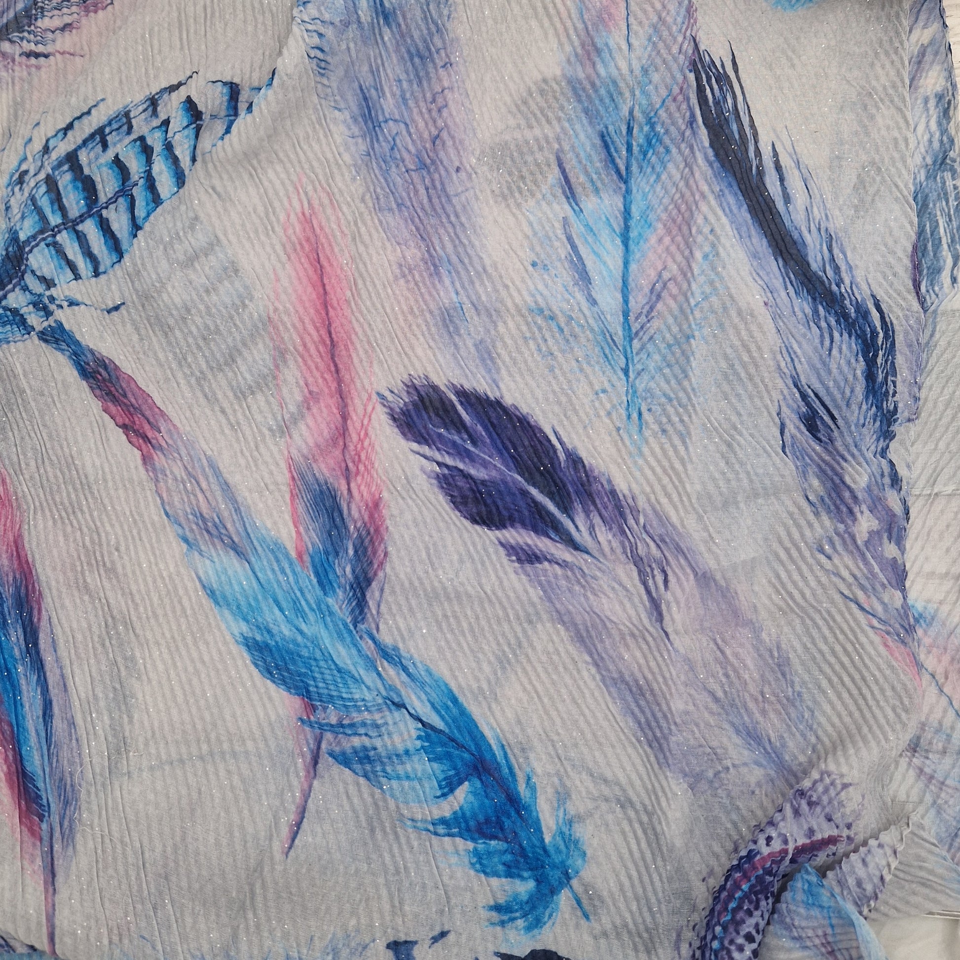 Crinkle effect pale grey scarf decorated with feathers in blue, navy and hot pink.