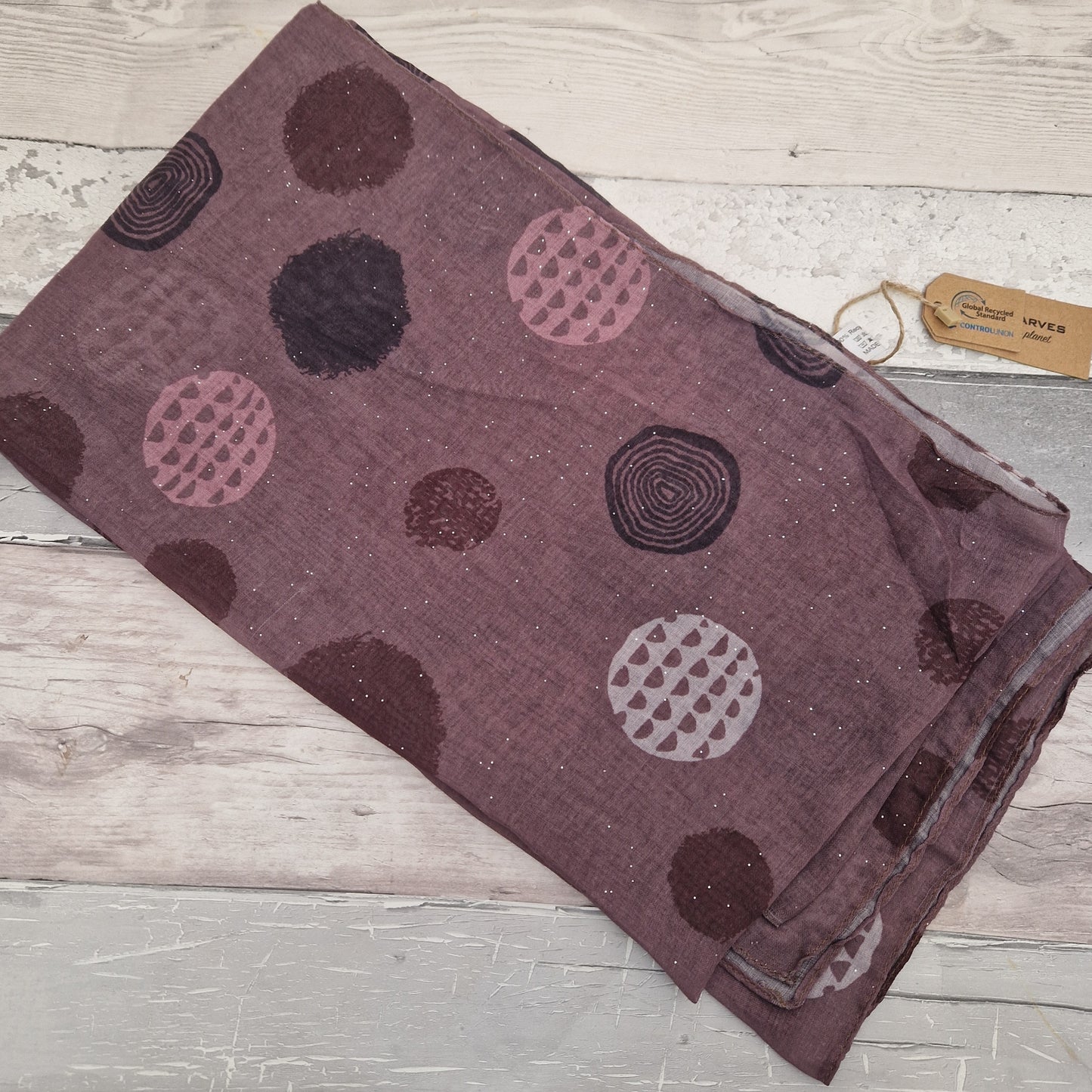 Rose Pink coloured scarf decorated with abstract circles in contrasting colours.