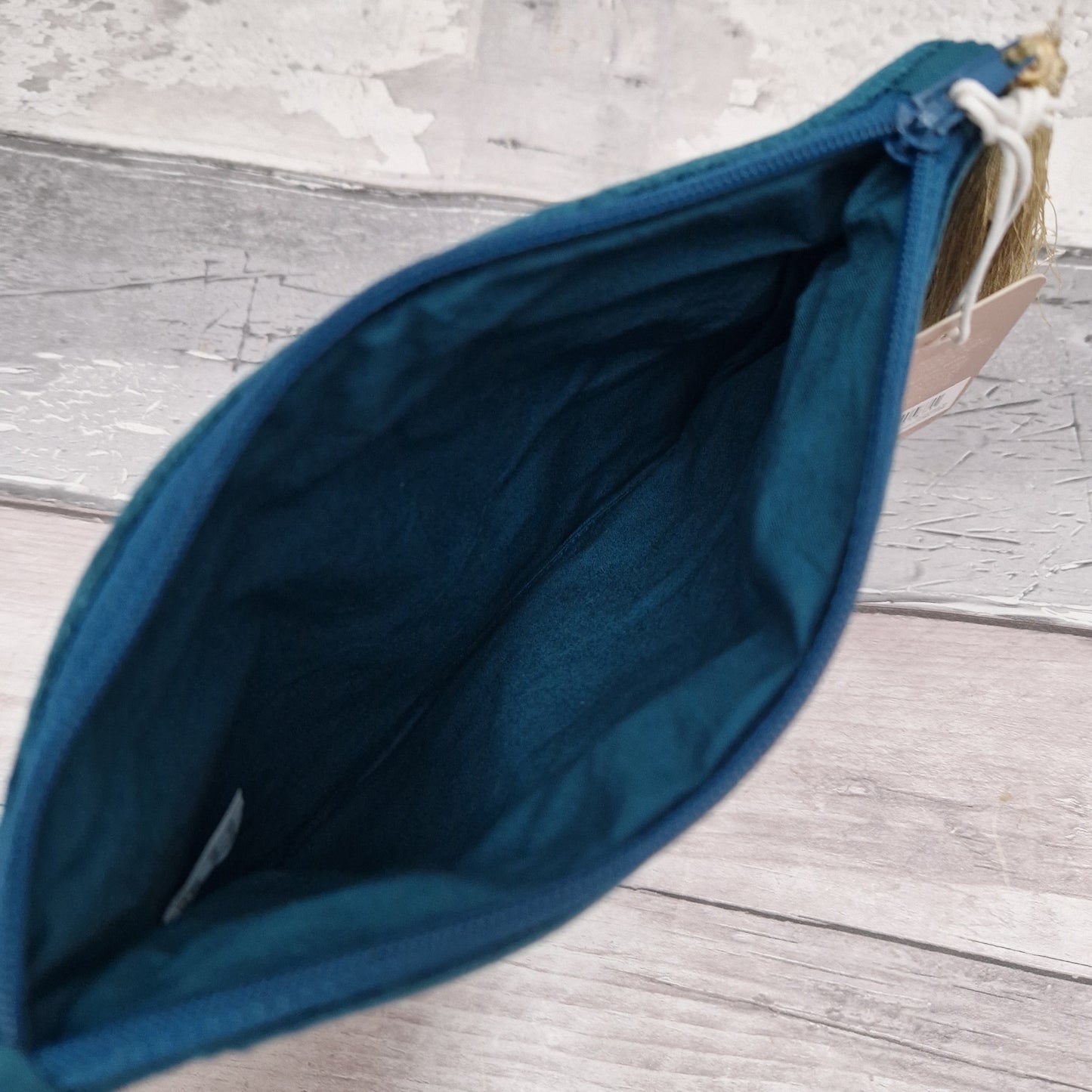 View into turquoise velvet pouch.