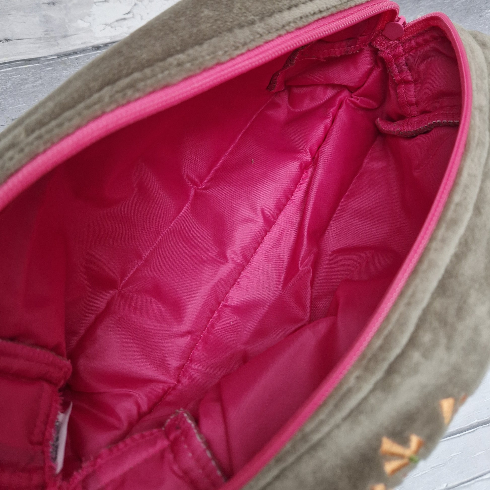 Inside pink lining of our sage coloured velvet washbag.