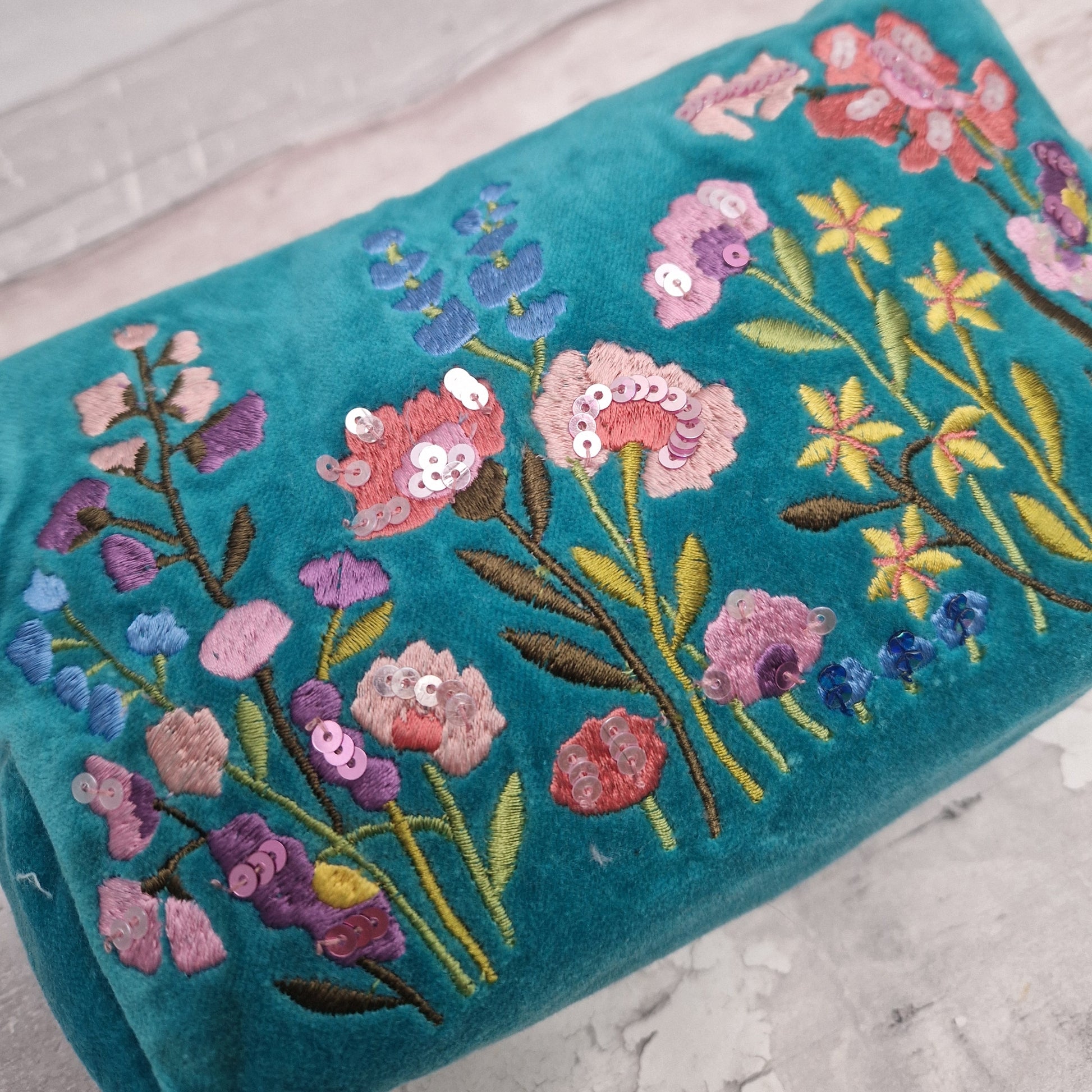 Close up view of our turquoise blue wash bag.