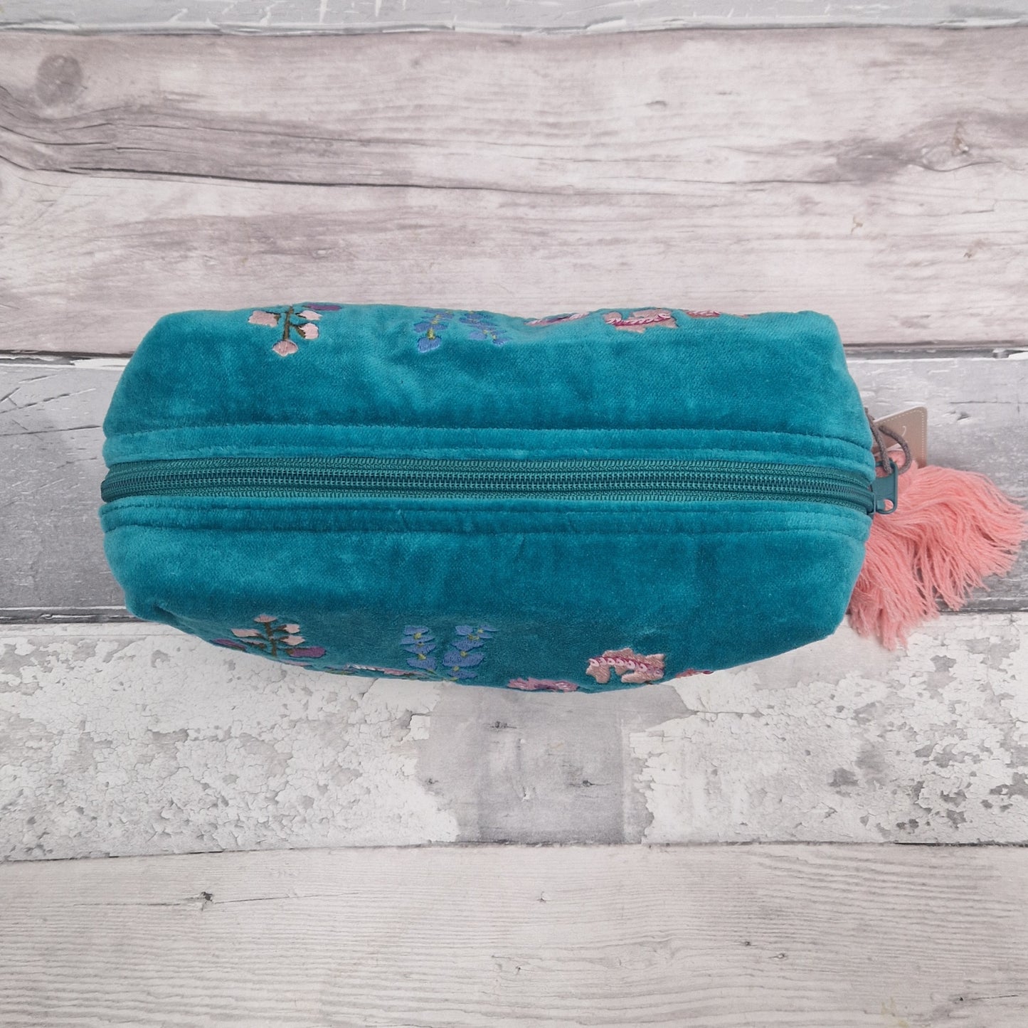 Top down view of our turquoise blue wash bag.