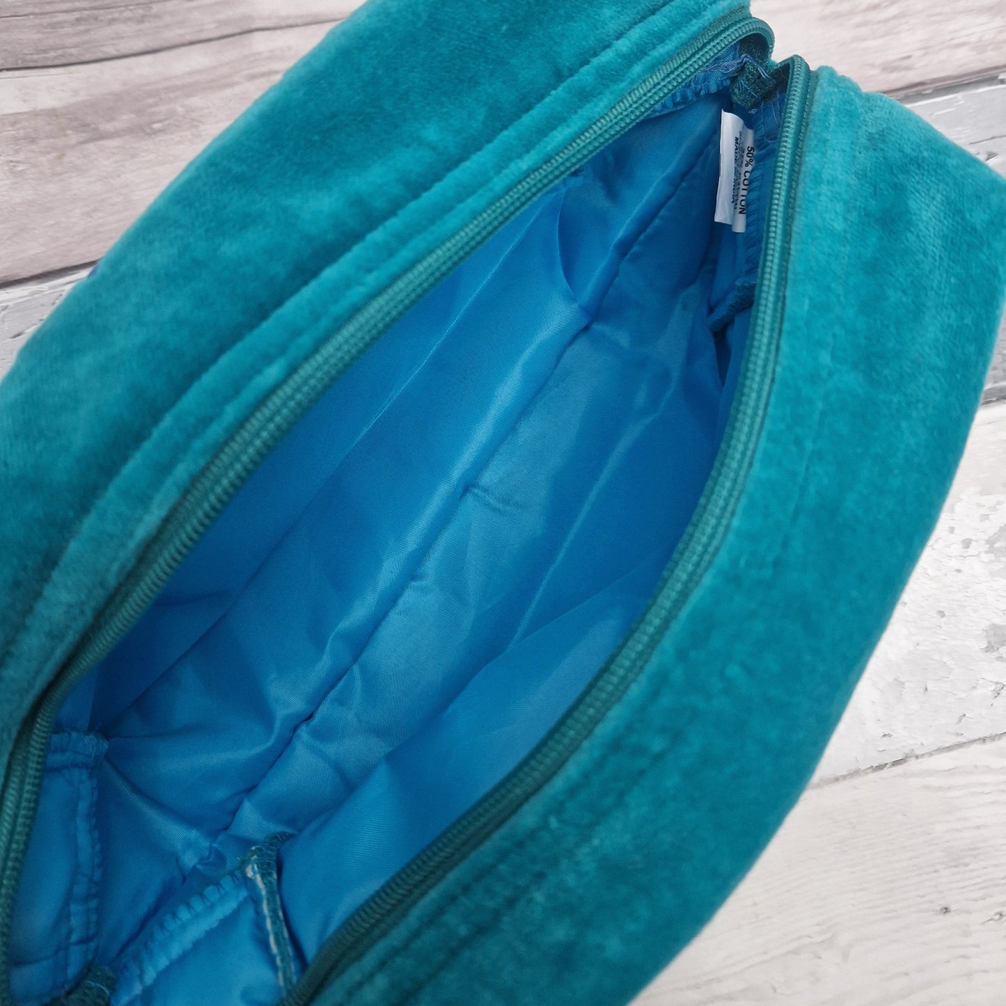 Inside view of our turquoise velvet wash bag.