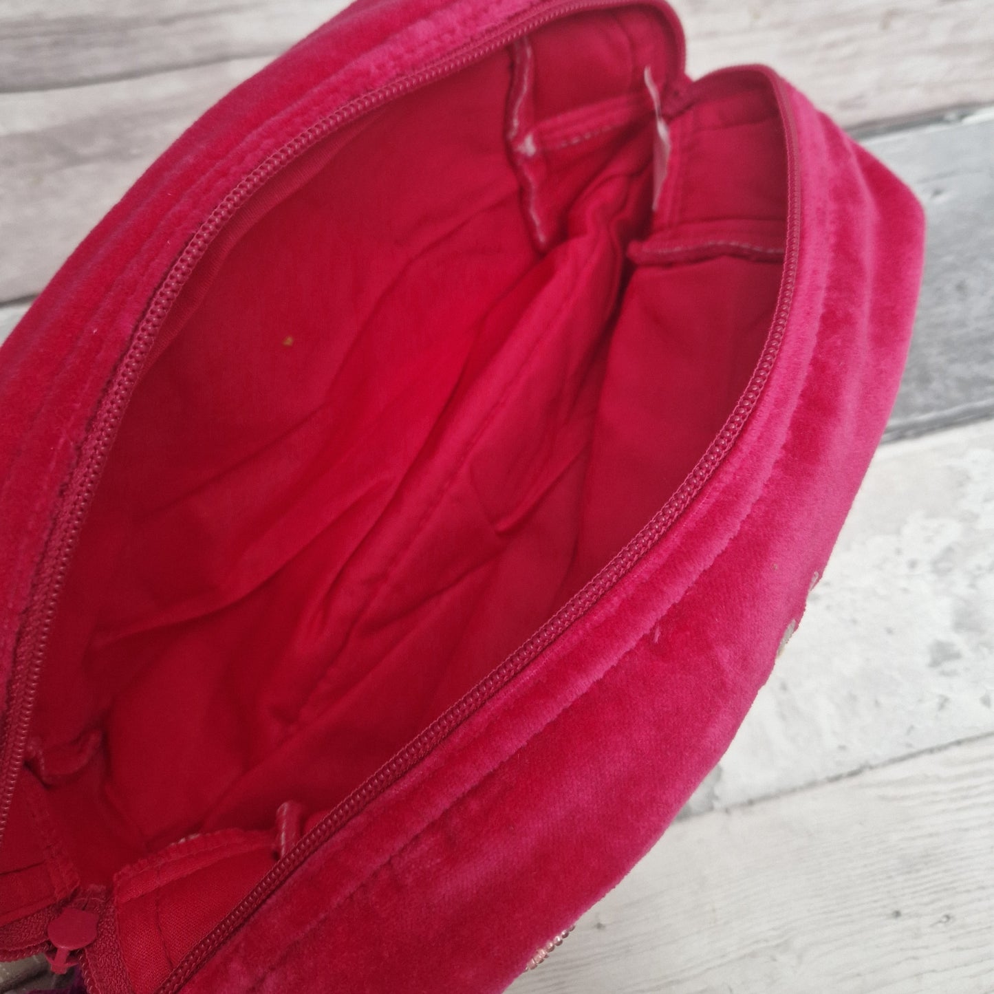 Inside view of a hot pink wash bag.