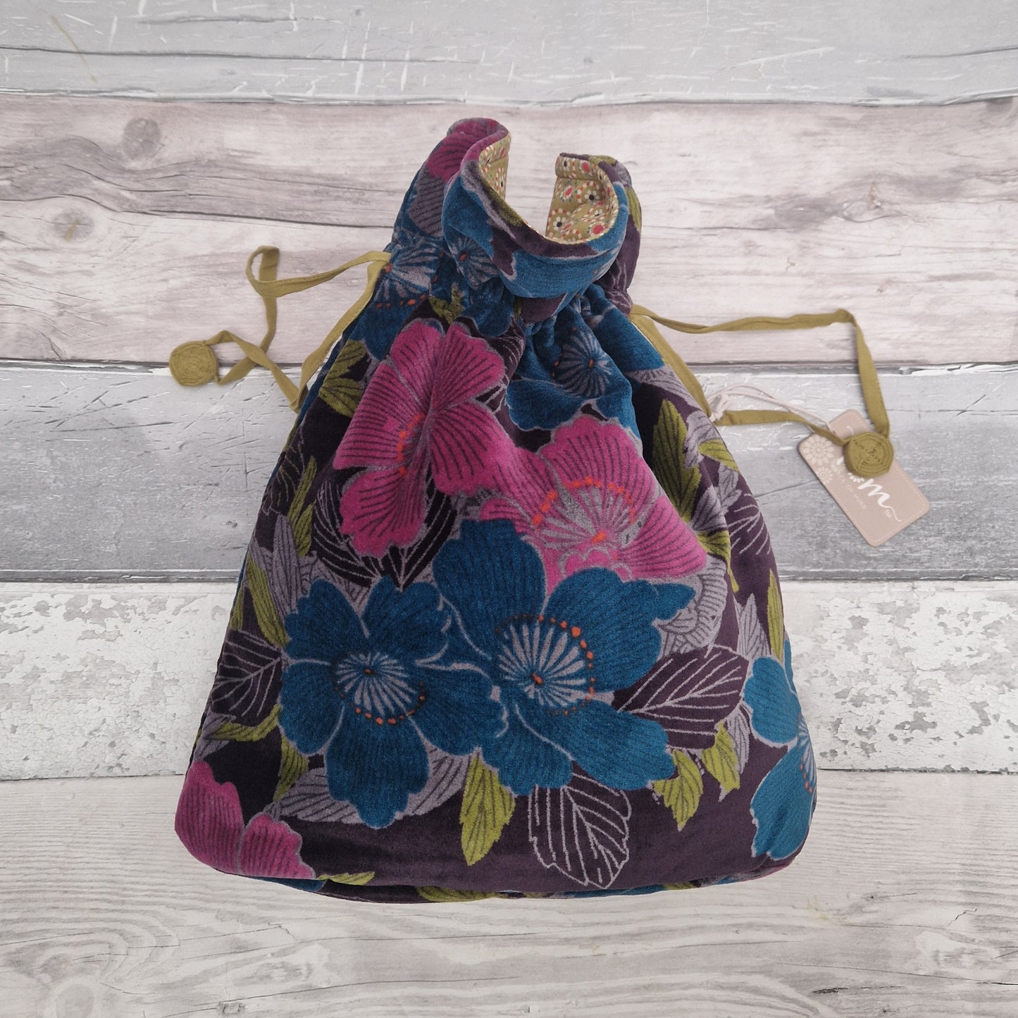 Large drawstring velvet pouch decorated in rich colours depicting an Hibiscus flower garden.