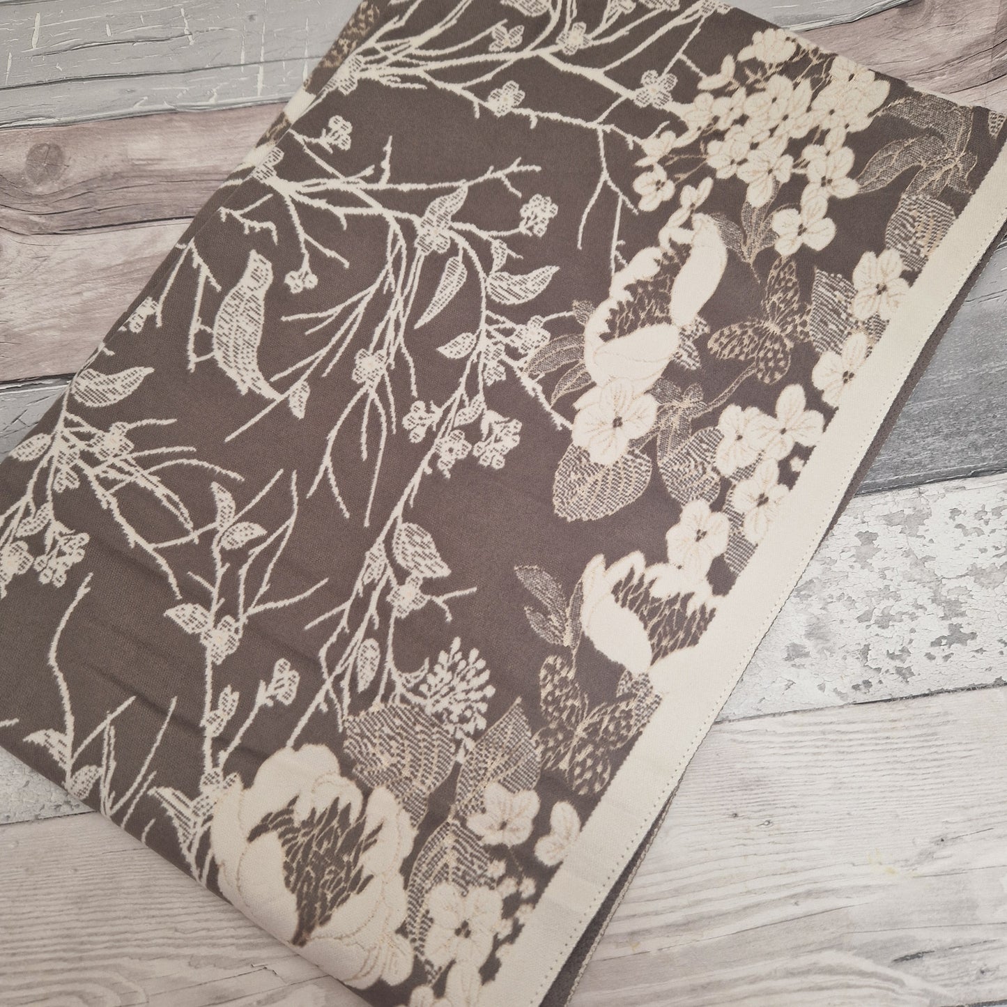 Cream and mocha coloured scarf in a Hedgerow print.