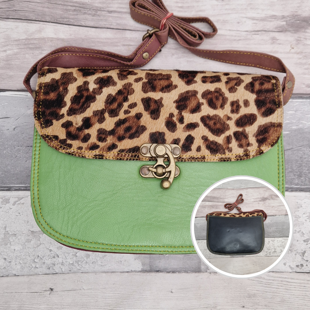 All leather bright green coloured bag with a textured panel of animal print. A brass swivel clasp secured the bag at the front.