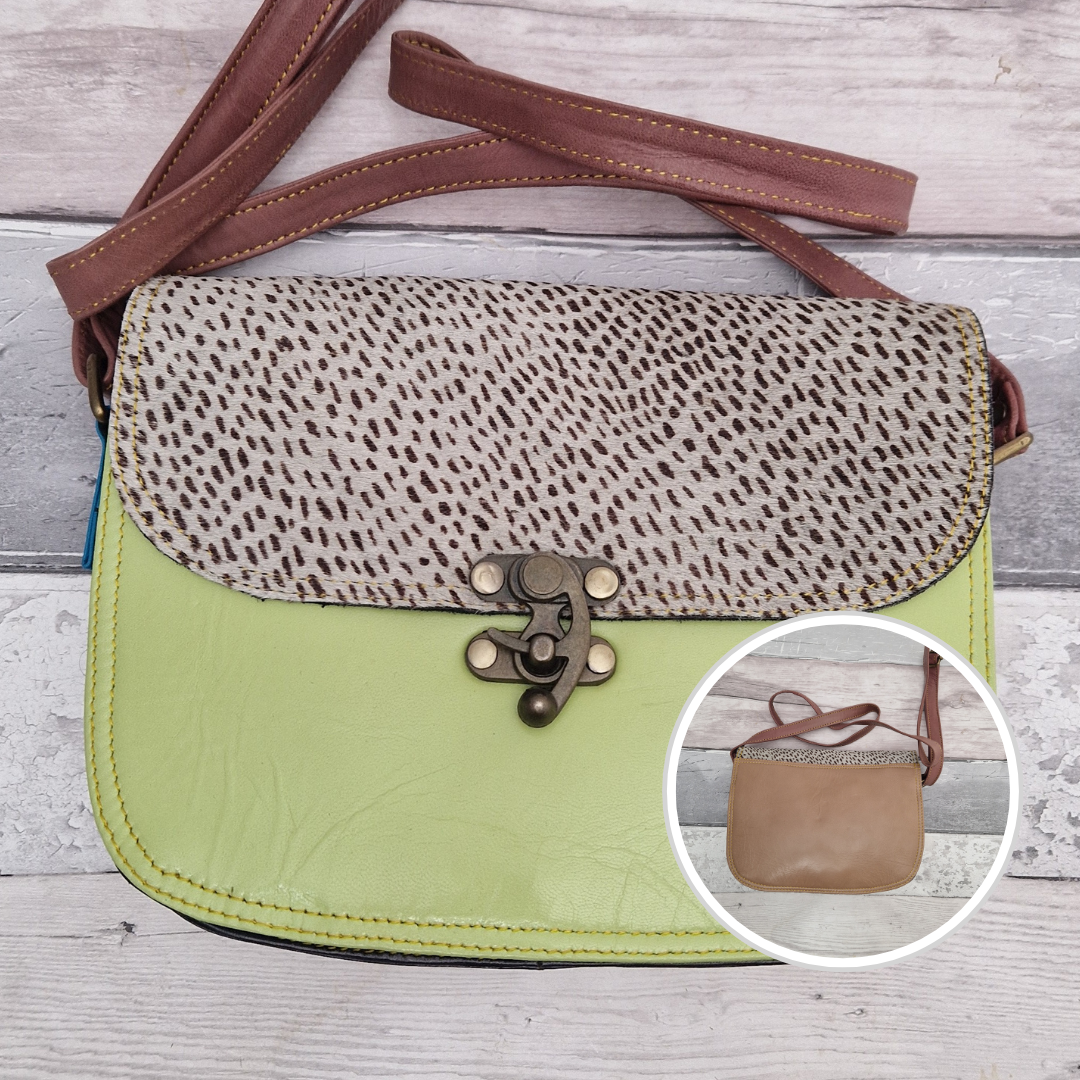 All leather pistachio coloured bag with a textured panel of lynx animal print. A brass swivel clasp secured the bag at the front.