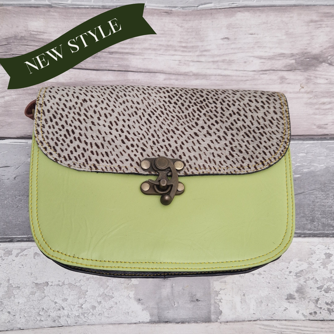 All leather pistachio coloured bag with a textured panel of lynx animal print. A brass swivel clasp secured the bag at the front.