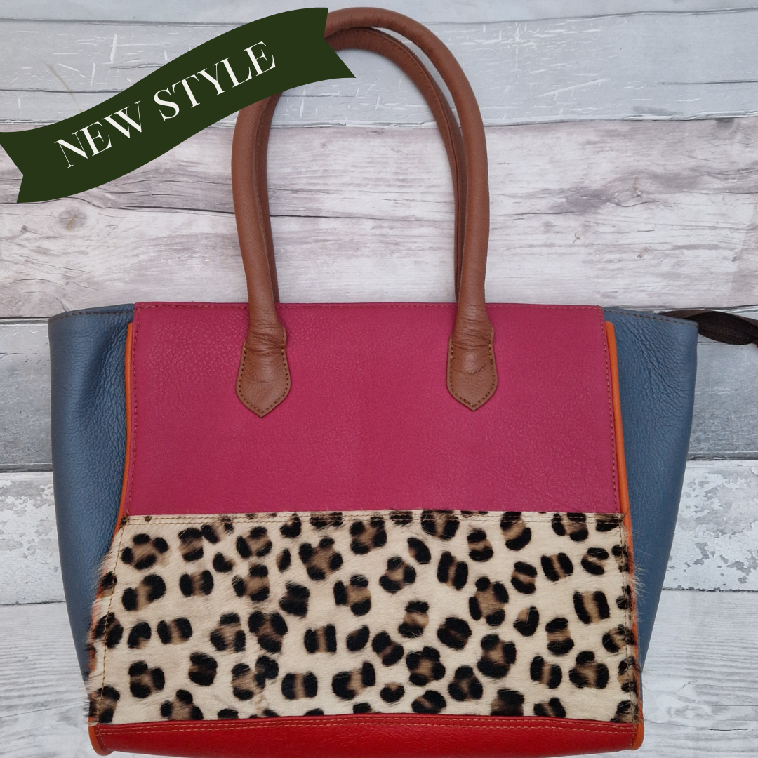 Long handled ladies handbag made from brightly coloured leather off-cuts with a textured panel of leopard print.