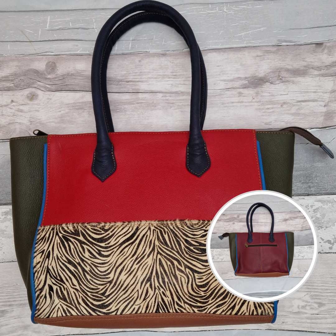 Long handled ladies handbag made from brightly coloured leather off-cuts with a textured panel of zebra print.