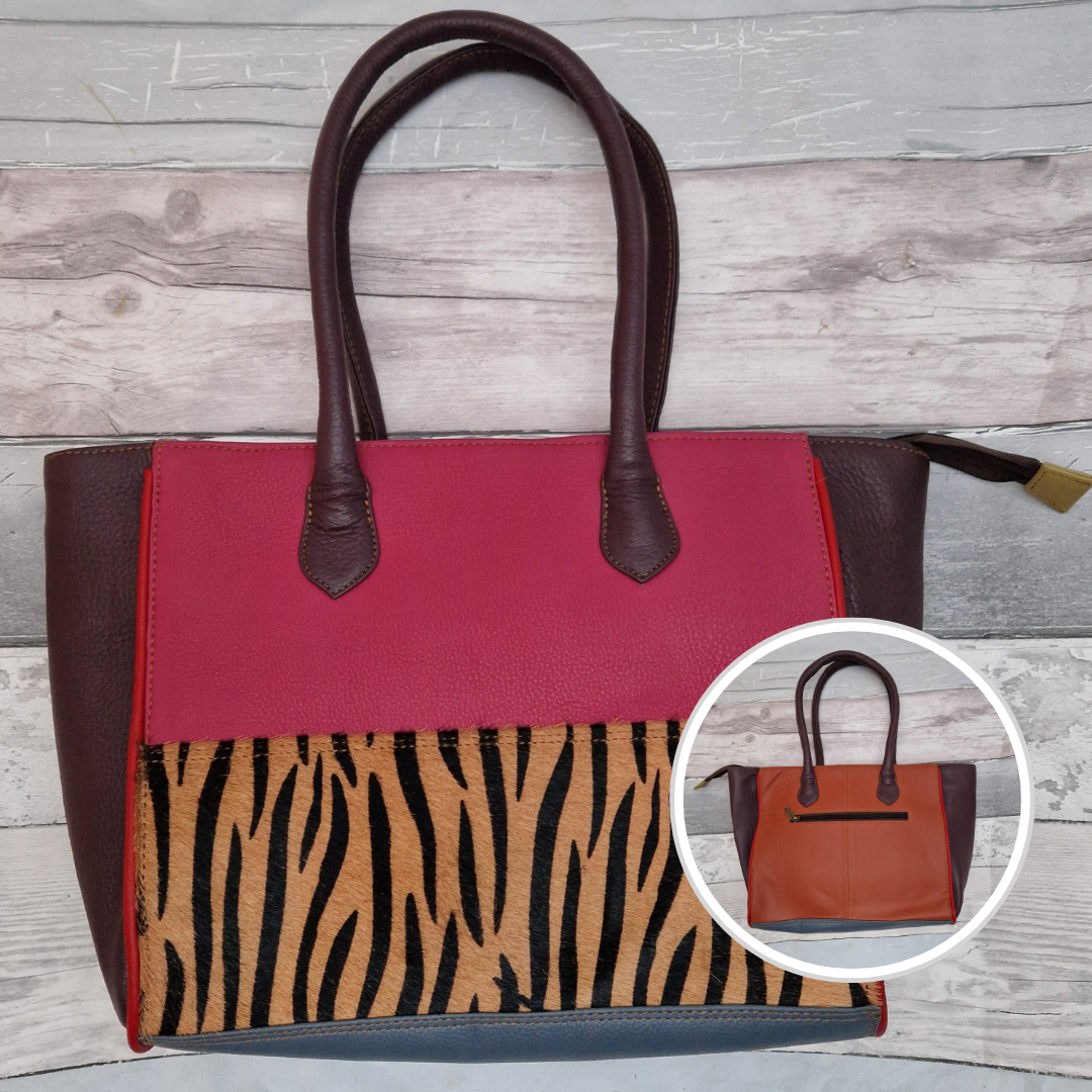 Long handled ladies handbag made from brightly coloured leather off-cuts with a textured panel of Zebra print.