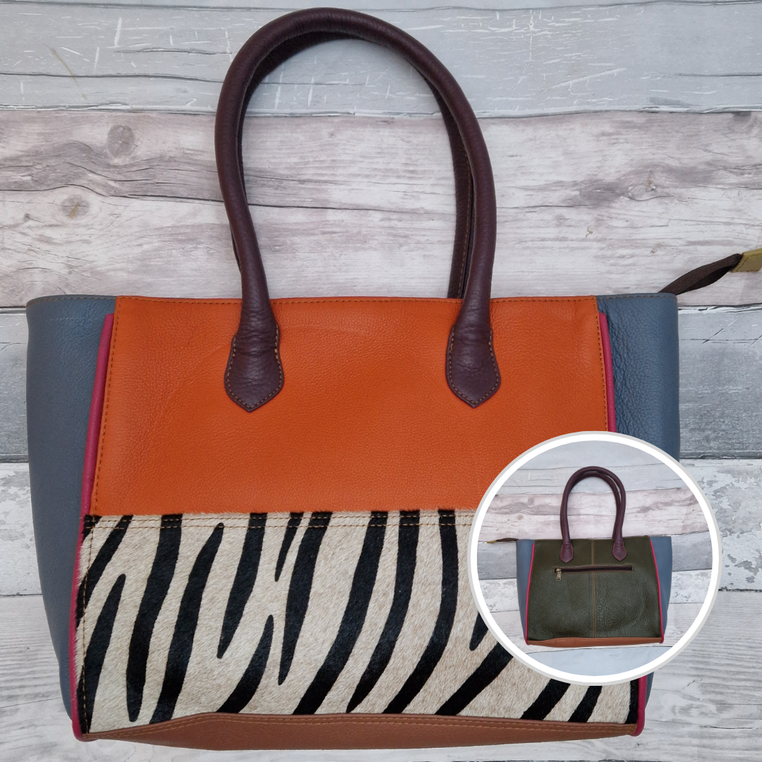 Long handled ladies handbag made from brightly coloured leather off-cuts with a textured panel of zebra print.