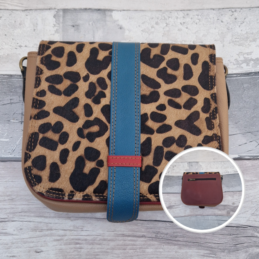 Zoya is a Messenger style bag with a tab on the front to lift for access. She is made from leather off-cuts and is presented in a multitude of colours finished with a large front panel in textured leopard animal print.